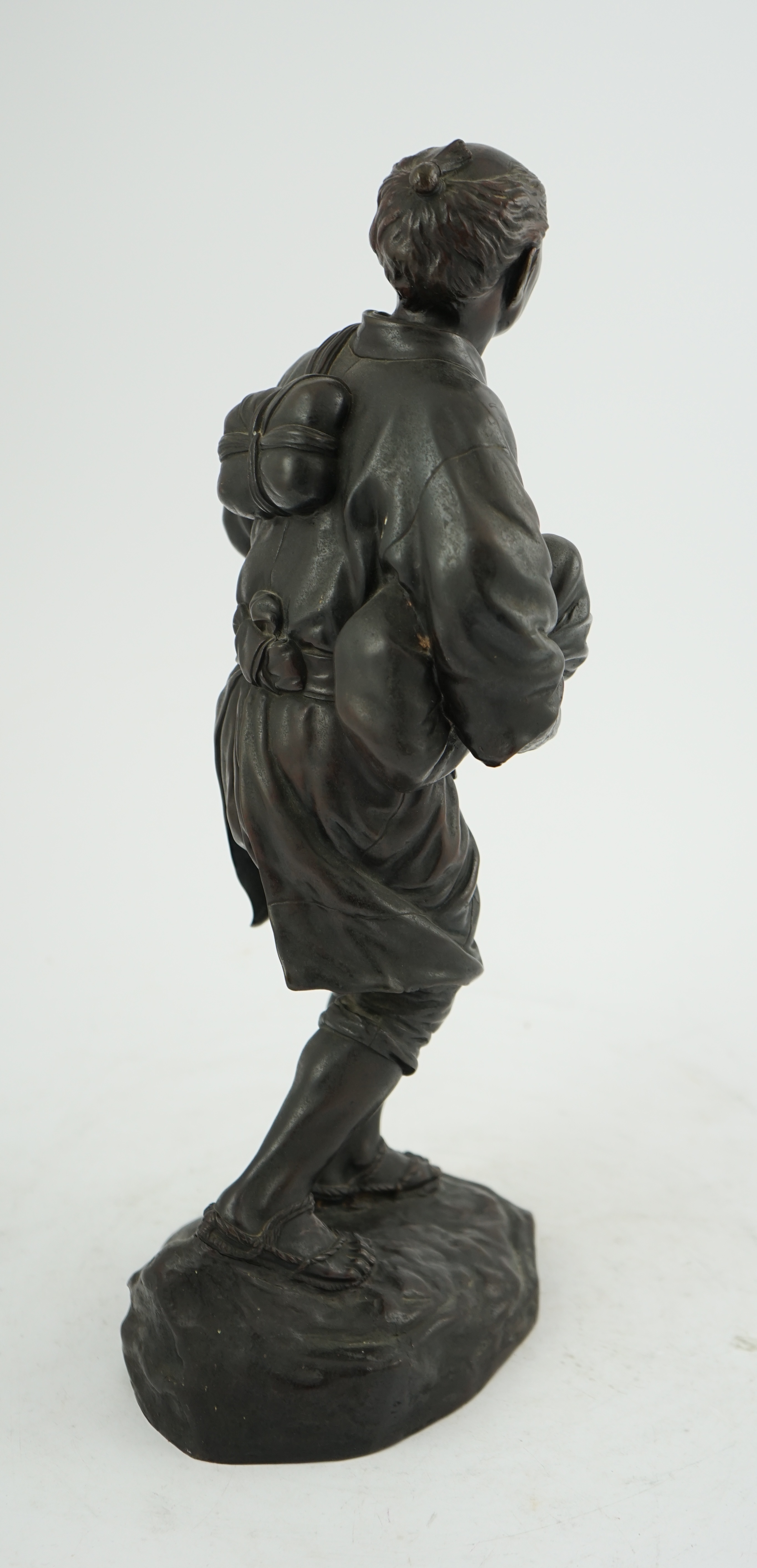 A Japanese bronze figure of a man, 19th century